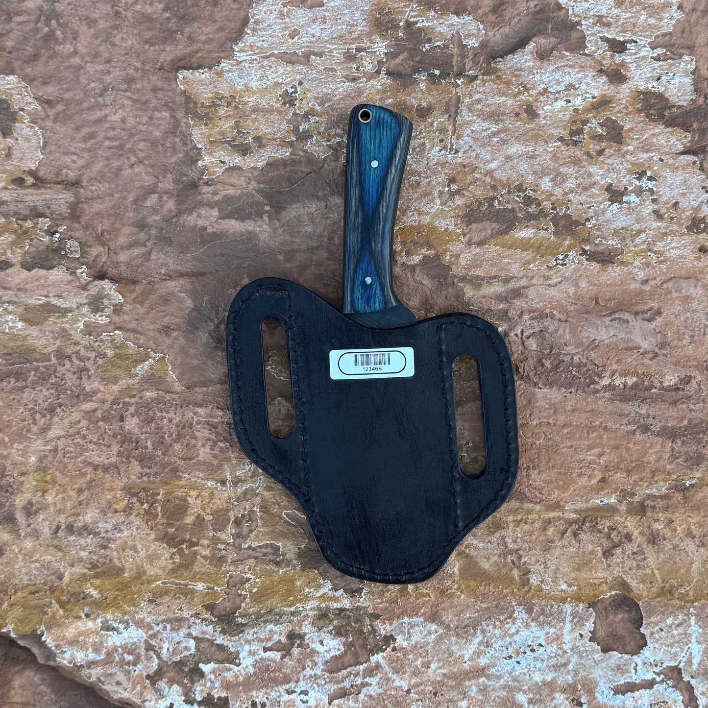 Blue Timber Rasp Knife with rasp-textured blade
Full-tang rasp knife on brown leather sheath
Blue and gray wood-grain handle close-up
Heavy-duty fixed blade displayed on wood background
Knife and hand-stitched leather sheath arranged together
Blue Timber Rasp Knife held in hand for scale
Outdoor utility knife in natural lighting
Rasp-style blade and wood handle detail shot