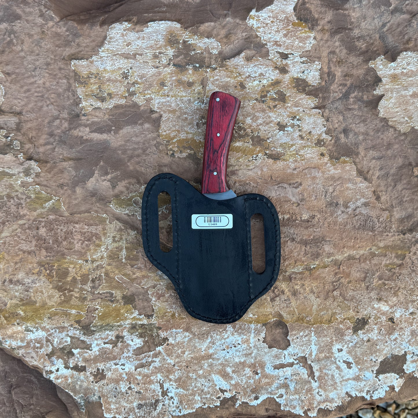 Ironwood Edge fixed blade knife with deep red wood handle
High-carbon blade displayed on brown leather sheath
Close-up of red hardwood handle with triple pins
Ironwood Edge knife on natural wood background
Knife and hand-stitched leather sheath arranged together
Outdoor fixed blade knife in natural lighting
Blue Spade Forge Ironwood Edge held in hand for scale
Rugged high-carbon knife ready for field and everyday use