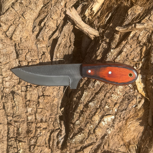 “Fixed-blade skinner knife with contoured handle”

“Outdoor skinner knife with curved blade”

“High-carbon steel skinner knife displayed on leather sheath”

“Skinning knife with ergonomic handle for field use”

“Hunting skinner knife with curved cutting edge”

“Fixed-blade knife designed for skinning and field dressing”

“Outdoor skinner blade on hand-stitched leather sheath”

“Precision skinner knife for hunting and field tasks”

“Skinner knife with hardwood handle and full tang construction”
