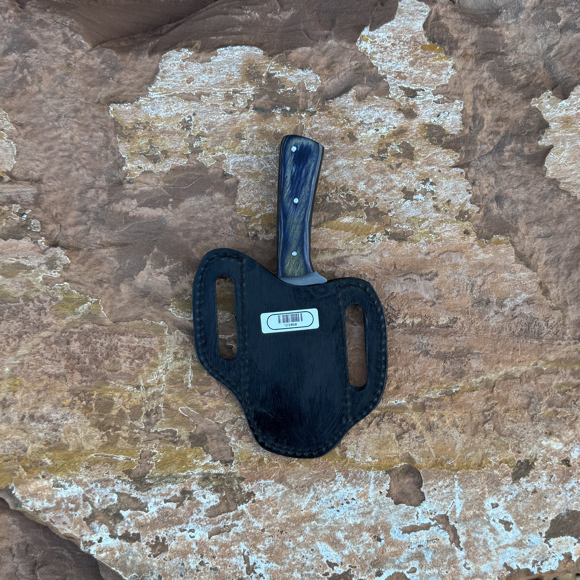 Timber Fang drop-point knife with wood-grain handle

Full-tang outdoor blade displayed on leather sheath

Close-up of dark and light wood grain handle with rivets

Timber Fang knife on natural wood background

Knife and star-accent leather sheath arranged together

Rugged field knife in natural lighting

Blue Spade Forge Timber Fang held in hand for scale

Drop-point fixed blade ready for outdoor field tasks