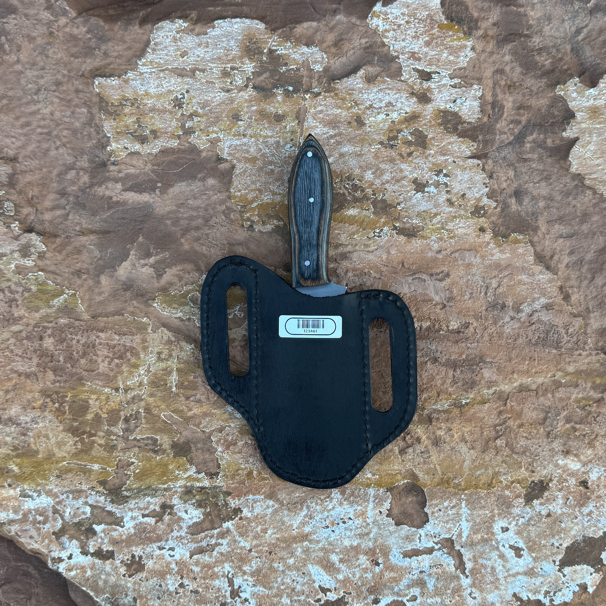 Midnight Timber clip-point knife with dark hardwood handle

Full-tang outdoor blade displayed on brown leather sheath

Close-up of dark-grain hardwood handle with triple rivets

Midnight Timber knife on natural wood background

Knife and hand-stitched leather sheath arranged for product showcase

Clip-point fixed blade in natural lighting

Blue Spade Forge Midnight Timber held in hand for scale

Rugged outdoor knife ready for hunting and field work