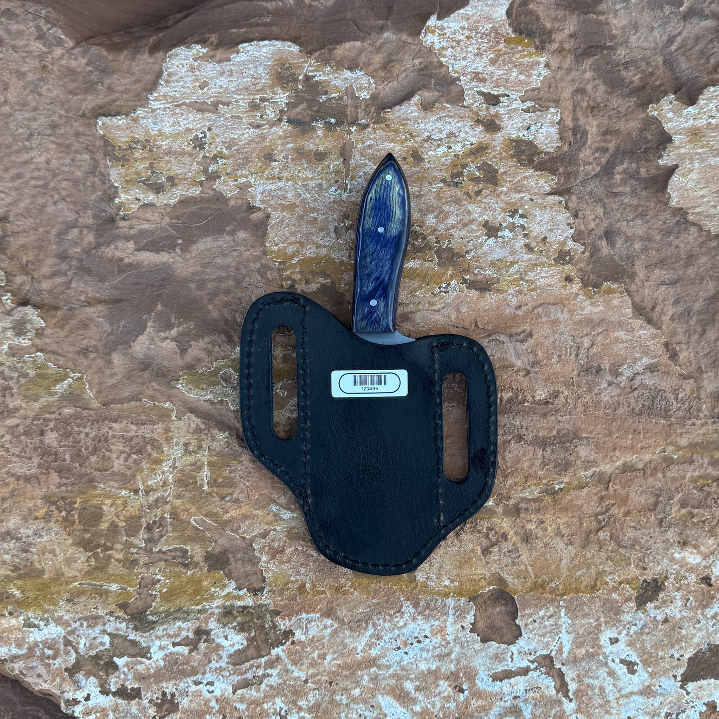 Midnight Ridge stainless fixed blade knife with blue resin handle

Curved stainless blade displayed on hand-stitched leather sheath

Swirled blue resin handle close-up

Midnight Ridge knife on natural wood background

Knife and leather sheath arranged for product display

Outdoor field knife in natural lighting

Blue Spade Forge Midnight Ridge held in hand for scale

Stainless fixed blade ready for trail and outdoor use