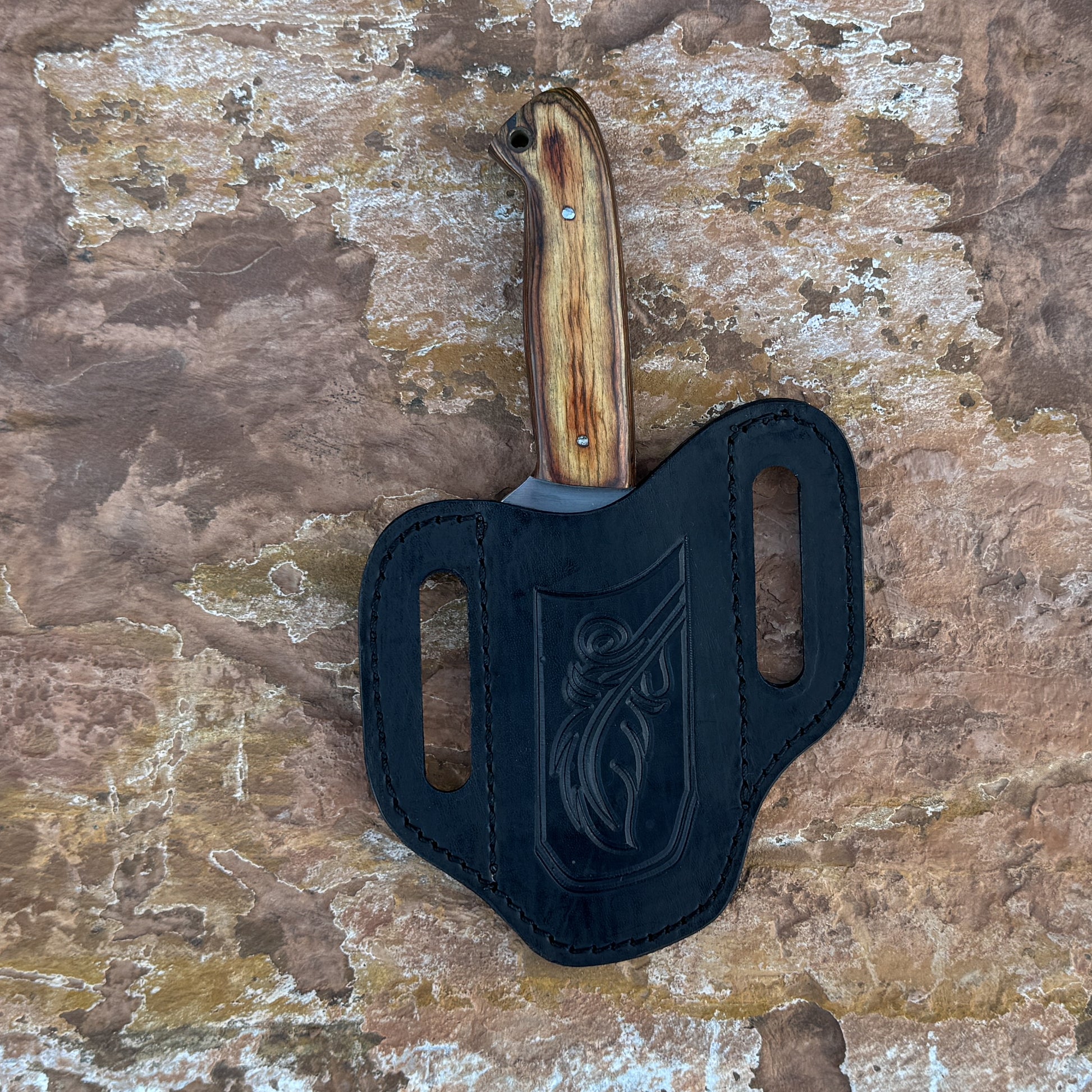 Sandridge stainless fixed blade knife with wood handle

Outdoor knife displayed on brown leather sheath

Natural wood handle with rich grain detail close-up

Stainless blade on rustic wood background

Sandridge knife and hand-stitched sheath arranged together

Fixed blade outdoor knife in natural lighting

Blue Spade Forge Sandridge held in hand for scale

Rugged field knife ready for trail and everyday tasks