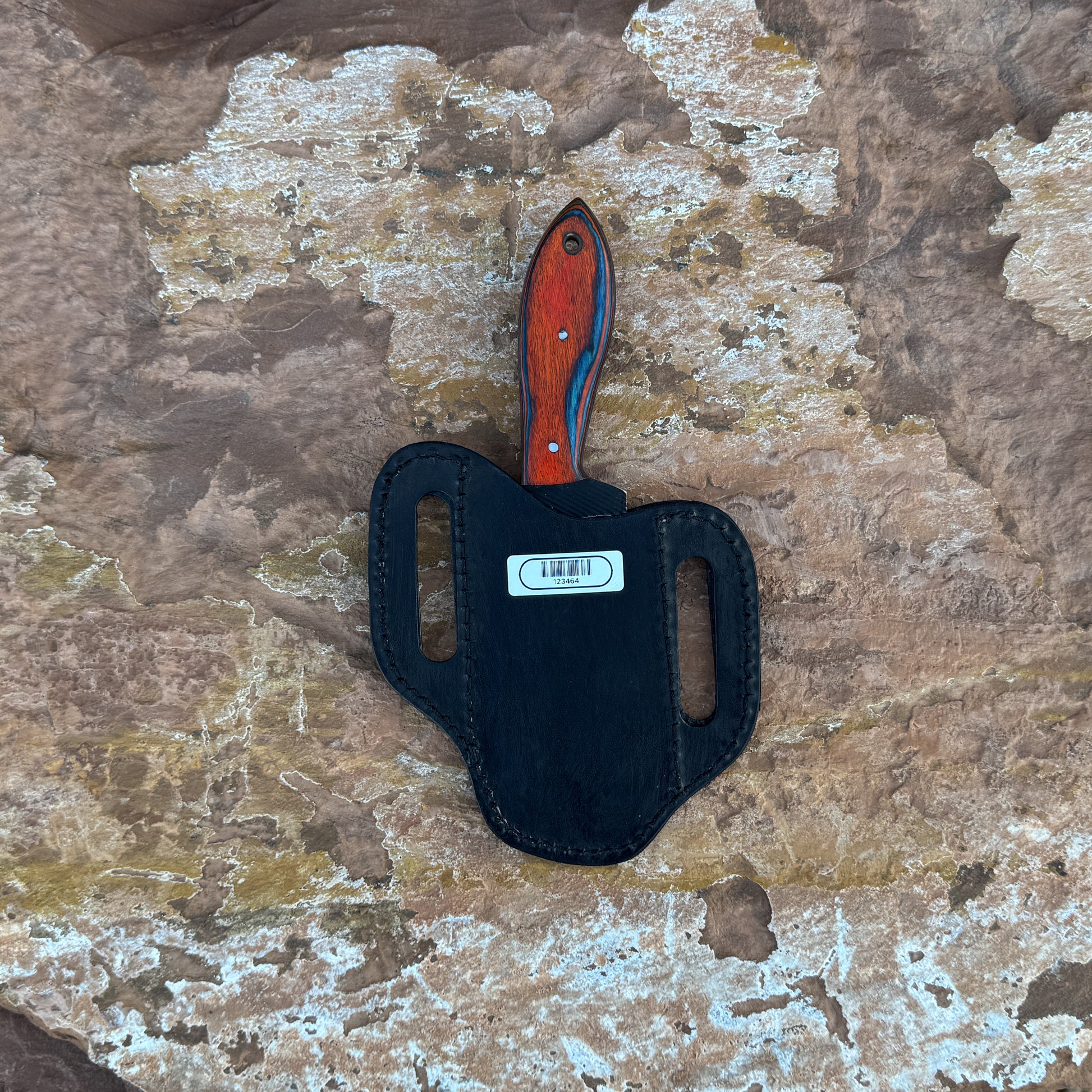 Red Ember Rasp Cleaver with red and blue hardwood handle

Close-up of rasp-textured spine on cleaver blade

Cleaver-style knife displayed on hand-stitched leather sheath

Full-tang cowboy cleaver on rustic wood background

Handle detail showing red-blue grain and brass hardware

Blade profile highlighting chopping edge and spine texture

Blue Spade Forge Red Ember Cleaver held in hand for scale

Leather sheath detail with stitching and natural finish