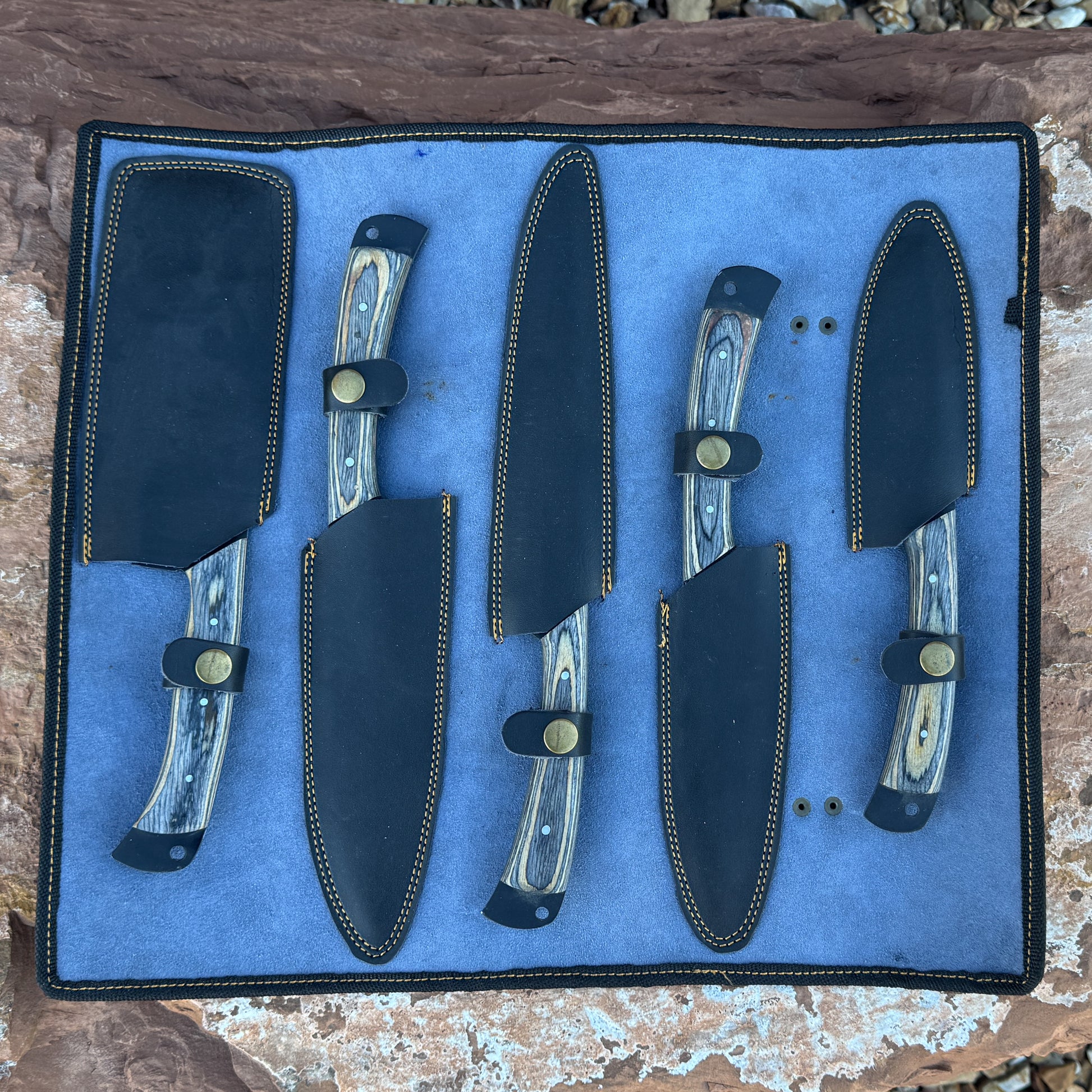 Ironwood Legacy 5-piece forged chef knife set stored inside a premium black leather knife roll.