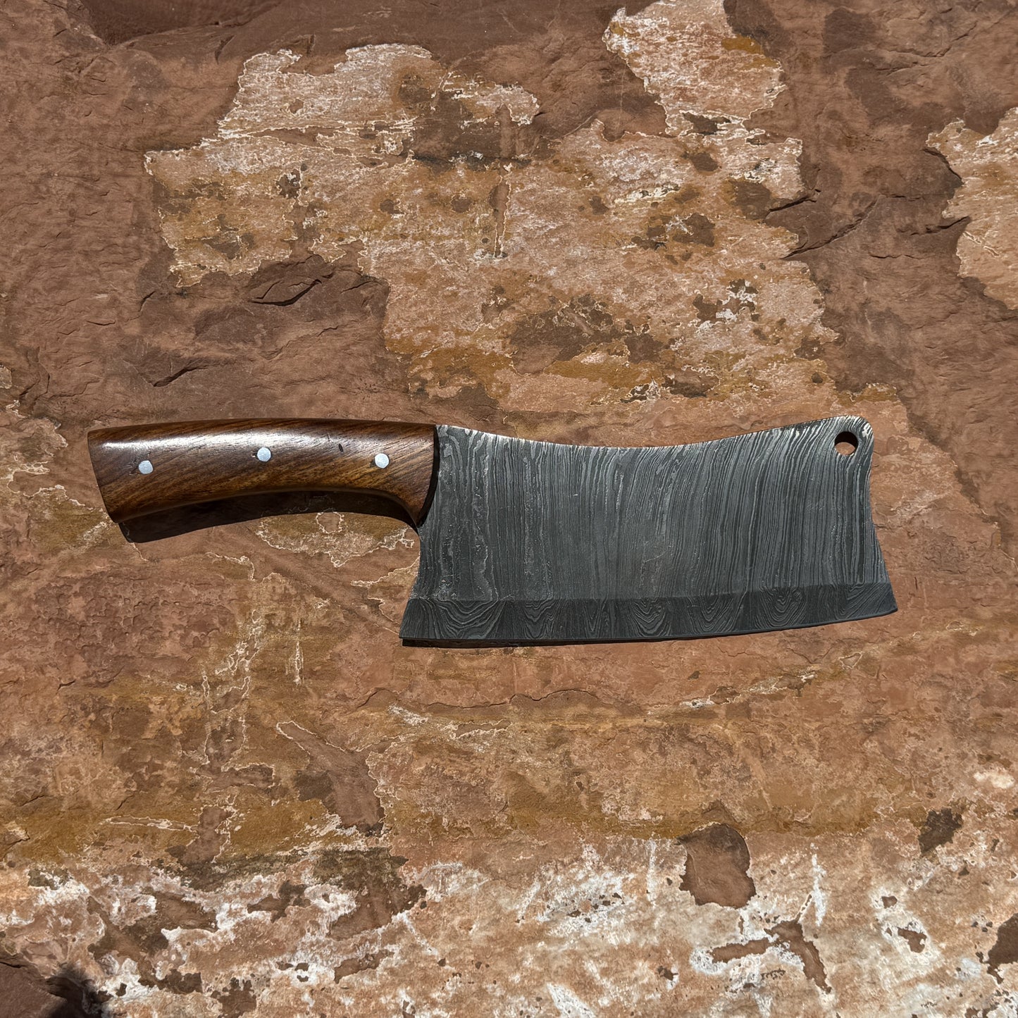 Ironwood Cleaver hand-forged Damascus meat and camp cleaver with contoured walnut handle