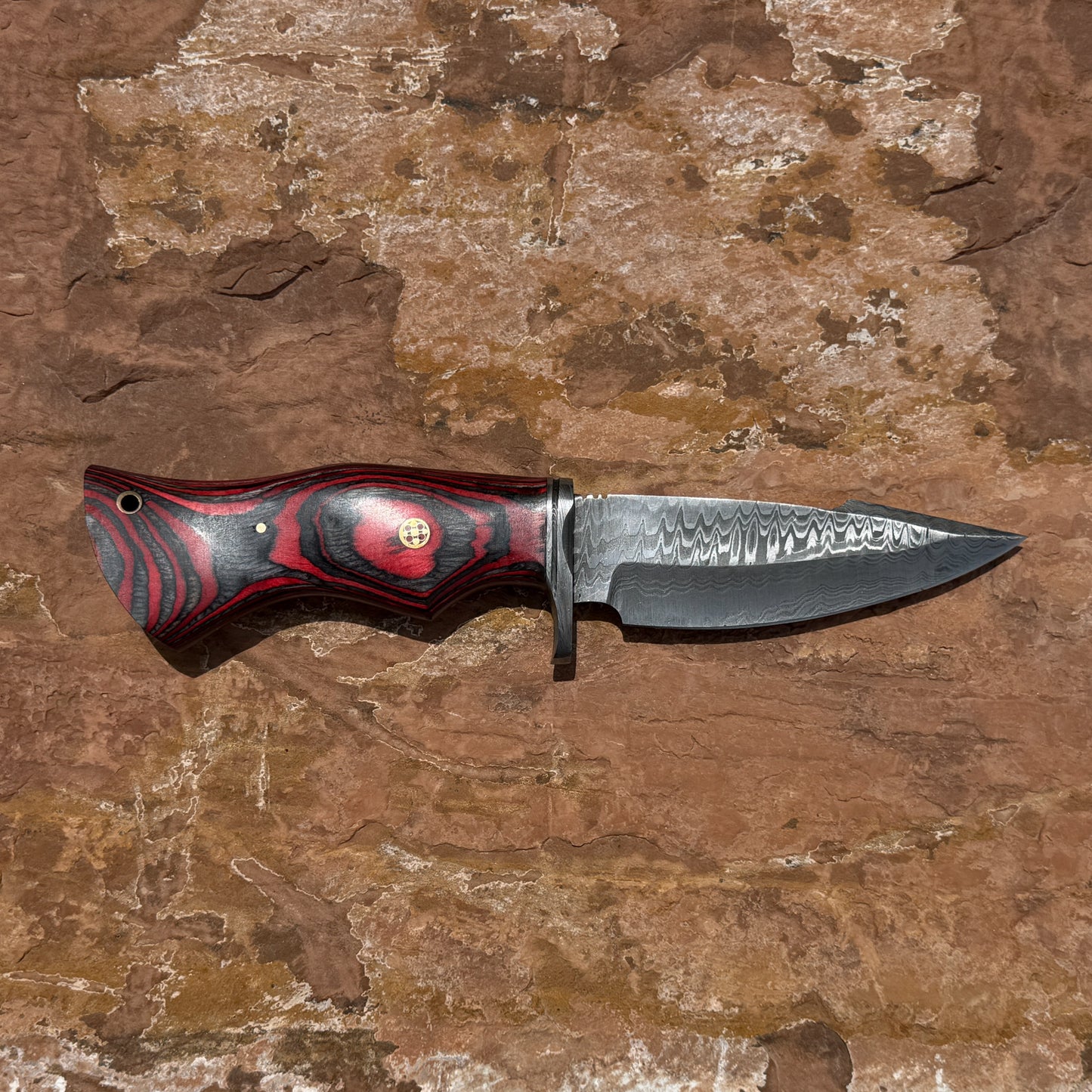 Backwood Hunter Scout hand-forged Damascus hunting knife with contoured red and black hardwood handle