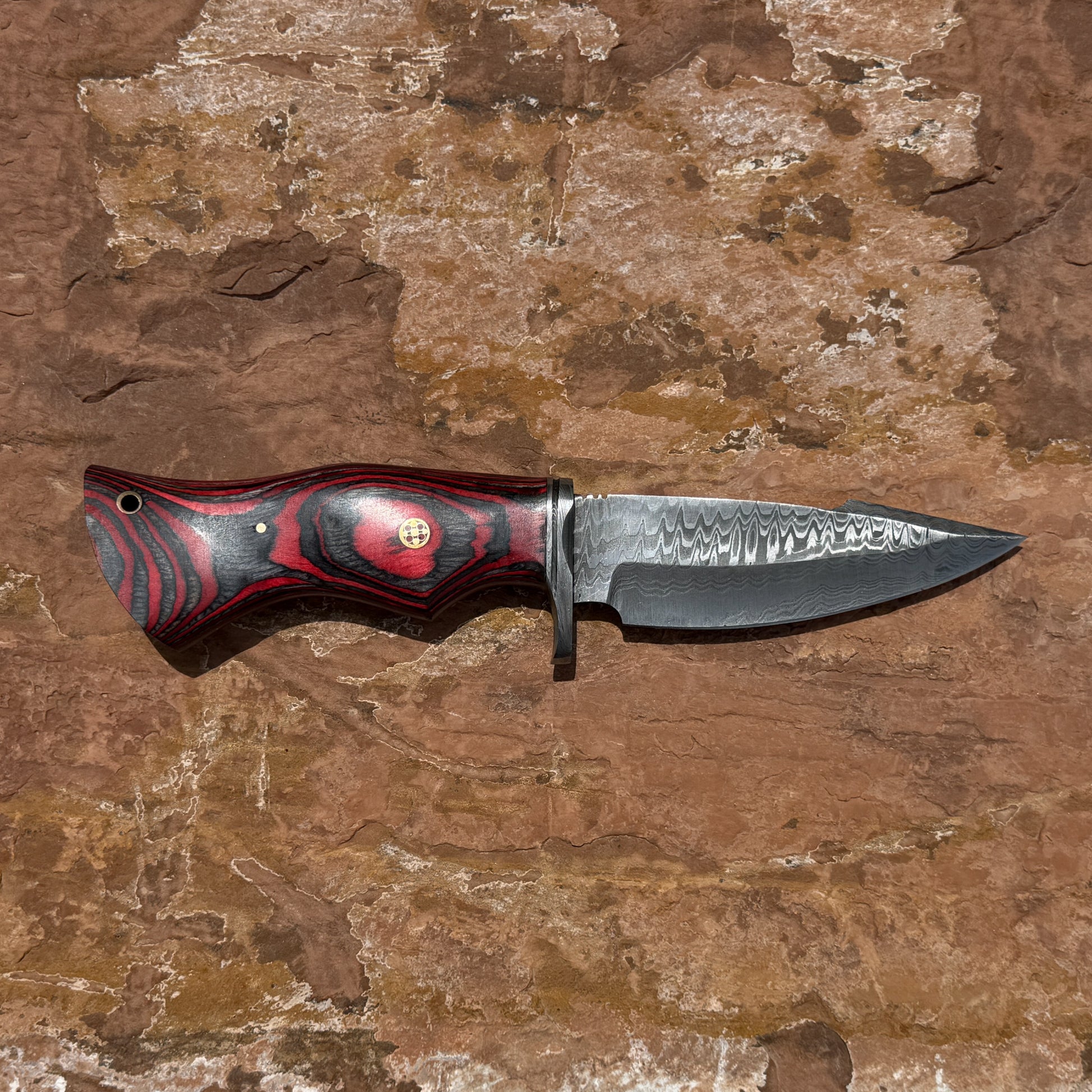 Backwood Hunter Scout hand-forged Damascus hunting knife with contoured red and black hardwood handle