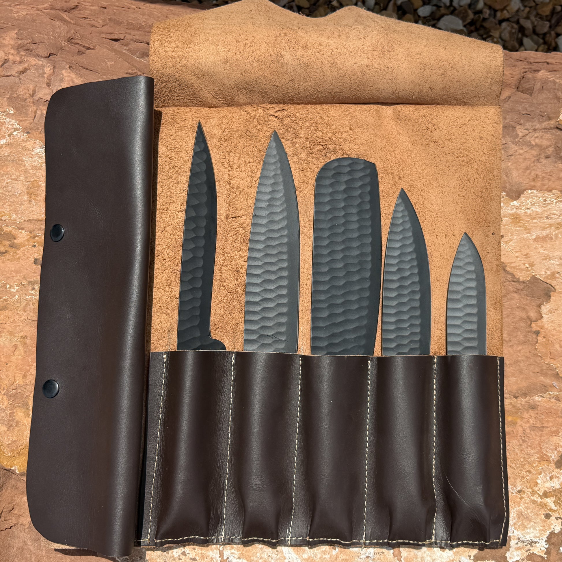 Black Summit Chef Set stored inside handcrafted leather knife roll for chefs, home kitchens, BBQ, and outdoor cooking